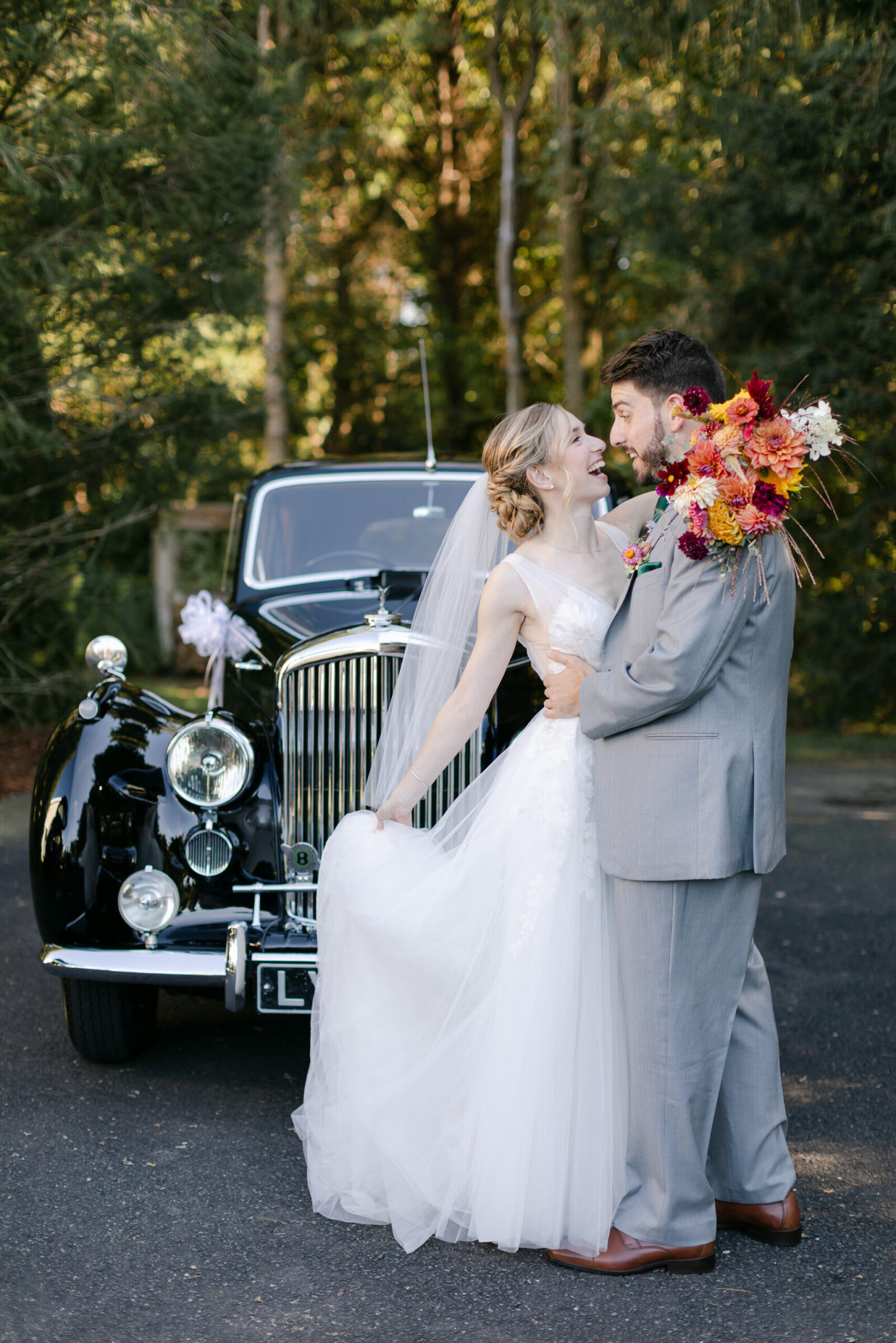 Bride and groom with vintage car at Connecticut wedding